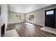 Living room with hardwood floors, fireplace, and large windows at 3100 Gray St, Denver, CO 80214