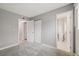 Bedroom with closet, featuring an ensuite bathroom with white marble flooring at 1231 S Crystal Way, Aurora, CO 80012
