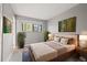 Charming bedroom features a queen size bed, window with natural light, and neutral decor at 1231 S Crystal Way, Aurora, CO 80012