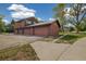 View of garages attached to a multi-unit property, featuring a large lot at 1231 S Crystal Way, Aurora, CO 80012