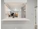 Kitchen view shows white cabinets, modern appliances, and backyard access at 1231 S Crystal Way, Aurora, CO 80012