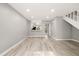Spacious living room has wood floors, stairs, and a kitchen view at 1231 S Crystal Way, Aurora, CO 80012