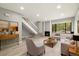 Stylish living room offers wood floors, a fireplace, and natural light at 1231 S Crystal Way, Aurora, CO 80012
