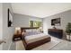 A stylish bedroom featuring a bed, modern decor, and a window with a view at 1231 S Crystal Way, Aurora, CO 80012