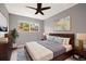 A beautifully furnished bedroom with a neutral palette, complemented by a cozy rug and modern decor at 1231 S Crystal Way, Aurora, CO 80012