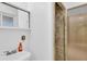 This bathroom vanity boasts a sink with chrome fixtures and an adjacent shower at 2978 Robb Cir, Lakewood, CO 80215