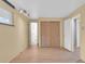 This bedroom boasts modern vinyl flooring, a closet and access to the bathroom at 2978 Robb Cir, Lakewood, CO 80215