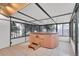 Enclosed hot tub room featuring tile floors, many windows, and an expansive view of the yard at 2978 Robb Cir, Lakewood, CO 80215