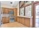 Well-lit kitchen featuring stainless steel appliances and lots of cabinet space at 2978 Robb Cir, Lakewood, CO 80215