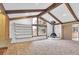 Living room with wood beams and a unique fireplace feature at 2978 Robb Cir, Lakewood, CO 80215