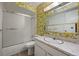 Clean bathroom with a shower/tub combo and updated vanity at 3855 S Monaco St # 176, Denver, CO 80237