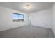 Large bedroom with grey carpet and lots of natural light at 3855 S Monaco St # 176, Denver, CO 80237