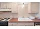 Clean kitchen with updated countertops and appliances at 3855 S Monaco St # 176, Denver, CO 80237