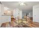 Kitchen features light wood cabinets and an adjacent dining area at 3855 S Monaco St # 176, Denver, CO 80237