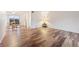 Living room with hardwood floors and access to a dining area at 3855 S Monaco St # 176, Denver, CO 80237