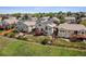Aerial view of home showing backyard with deck, lawn, and solar panels in a suburban neighborhood at 3418 Oak Leaf Pl, Highlands Ranch, CO 80129