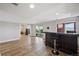 Finished basement with a large bar and mountain views provides an ideal space for entertaining guests at 3418 Oak Leaf Pl, Highlands Ranch, CO 80129