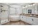 Luxurious bathroom features a walk-in shower, soaking tub, and double vanity at 3418 Oak Leaf Pl, Highlands Ranch, CO 80129
