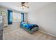 Bedroom with a bright window, ceiling fan, and a playful blue theme at 3418 Oak Leaf Pl, Highlands Ranch, CO 80129