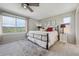 Bright bedroom featuring expansive windows with picturesque views and a stylish rug at 3418 Oak Leaf Pl, Highlands Ranch, CO 80129