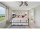 Inviting bedroom boasts scenic views from the windows and an attached ensuite bathroom at 3418 Oak Leaf Pl, Highlands Ranch, CO 80129