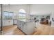 Bright open concept kitchen with an island with barstool seating and stainless steel appliances at 3418 Oak Leaf Pl, Highlands Ranch, CO 80129
