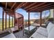 Covered patio with spiral staircase, seating, and mountain views offers a great outdoor living space at 3418 Oak Leaf Pl, Highlands Ranch, CO 80129