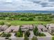 Aerial view showcases the neighborhood's golf course, mountain views, and community layout at 8993 Stonecrest Way, Highlands Ranch, CO 80129