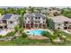 Aerial view showcases the home's pool, yard, solar panels and landscaped backyard at 8993 Stonecrest Way, Highlands Ranch, CO 80129