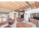 Unfinished basement with exposed ceiling beams, providing ample room for recreation at 8993 Stonecrest Way, Highlands Ranch, CO 80129