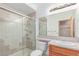 Clean bathroom featuring tiled shower, single sink and wood vanity at 8993 Stonecrest Way, Highlands Ranch, CO 80129