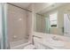 Tiled bathroom featuring a bathtub, shower, toilet, and vanity sink with neutral wall coloring at 8993 Stonecrest Way, Highlands Ranch, CO 80129