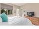 Bedroom featuring a large window, a queen-sized bed and a dresser at 8993 Stonecrest Way, Highlands Ranch, CO 80129