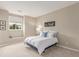 Neutral bedroom featuring a queen bed, neutral carpet, and bright natural light at 8993 Stonecrest Way, Highlands Ranch, CO 80129
