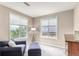 Cozy bedroom offers a comfortable seating area and picturesque views at 8993 Stonecrest Way, Highlands Ranch, CO 80129