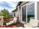 Charming outdoor deck featuring comfortable seating, an umbrella, and picturesque views at 8993 Stonecrest Way, Highlands Ranch, CO 80129