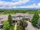 Beautiful two-story home with lush landscaping, a well-manicured lawn, and mountain views at 8993 Stonecrest Way, Highlands Ranch, CO 80129