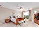 Comfortable main bedroom boasts a private balcony and ample natural light at 8993 Stonecrest Way, Highlands Ranch, CO 80129