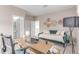 Comfortable home office space with a couch, desk, and decorative wall hangings at 8993 Stonecrest Way, Highlands Ranch, CO 80129