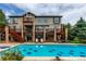 Stunning outdoor pool with decorative tile in the backyard of this multi-story home at 8993 Stonecrest Way, Highlands Ranch, CO 80129