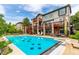 Beautiful backyard pool with diving board and patio seating, perfect for outdoor entertaining at 8993 Stonecrest Way, Highlands Ranch, CO 80129