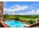 In-ground pool with golf course views at 8993 Stonecrest Way, Highlands Ranch, CO 80129