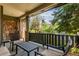 Cozy covered front porch with stone accents and comfortable seating at 8993 Stonecrest Way, Highlands Ranch, CO 80129