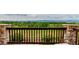 Stunning view from the outdoor deck showcasing lush greenery and distant mountains at 8993 Stonecrest Way, Highlands Ranch, CO 80129