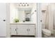 Clean and well-maintained bathroom with a large mirror, vanity, and a separate toilet area at 1911 S Hannibal St # H, Aurora, CO 80013