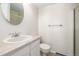 Cozy bathroom featuring a sleek single sink vanity and a glass door shower at 1911 S Hannibal St # H, Aurora, CO 80013