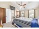Comfortable bedroom featuring vaulted ceilings, closet space, and natural light at 1911 S Hannibal St # H, Aurora, CO 80013