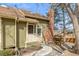 Inviting exterior view of home showcasing a front porch, brick chimney, and professionally landscaped yard at 1911 S Hannibal St # H, Aurora, CO 80013