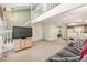 Spacious living area with stairs, open floor plan, and view into the kitchen at 1911 S Hannibal St # H, Aurora, CO 80013