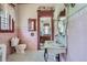 Classic bathroom features pink tiling and a vintage-style sink, offering a unique and nostalgic appeal at 1000 N Logan St, Denver, CO 80203